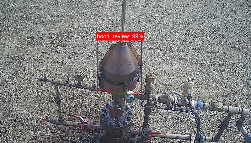 AI detecting a potential oil leak at the pumpjack hood, highlighted with a 99% confidence bounding box